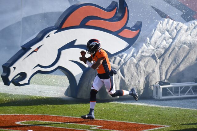 Denver Broncos quarterback Kendall Hinton (2) hits the field prior to the game against the New Orleans Saints in the first quarter at Empower Field at Mile High.