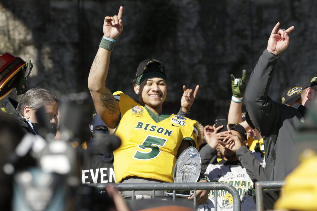 North Dakota State Bison quarterback Trey Lance (5) celebrates winning the game against the James Madison Dukes at Toyota Stadium.