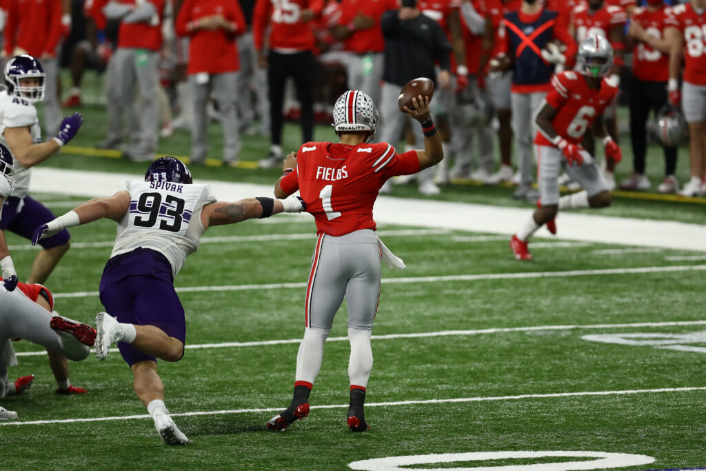 Northwestern Wildcats defensive lineman Joe Spivak (93) pressures Ohio State Buckeyes quarterback Justin Fields (1) during the first half at Lucas Oil Stadium.