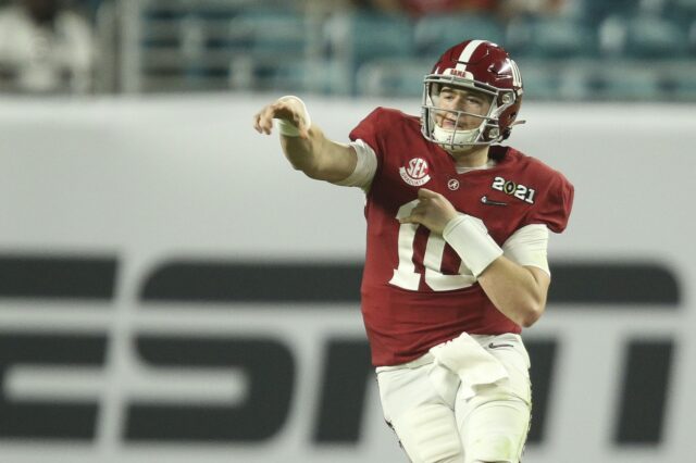 Mac Jones throws on the run. Credit: Gary Cosby, USA TODAY Sports.