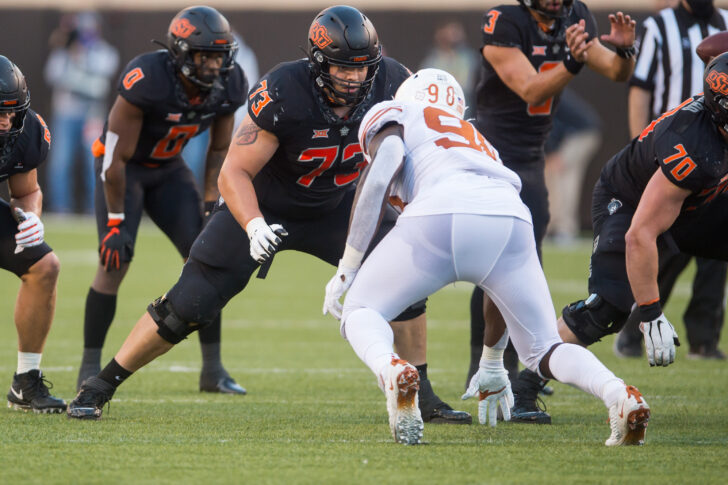 Oklahoma State Cowboys offensive lineman Teven Jenkins (73) blocks Texas Longhorns defensive lineman Moro Ojomo (98) during the fourth quarter at Boone Pickens Stadium.