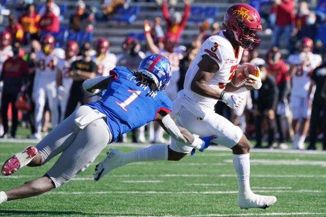 Iowa State Cyclones running back Kene Nwangwu (3) runs the ball as Kansas Jayhawks safety Kenny Logan Jr. (1) attempts a tackle during the game at David Booth Kansas Memorial Stadium.