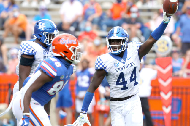 Kentucky Wildcats linebacker Jamin Davis (44) comes up with a fumbled ball during a football game against the Florida Gators at Ben Hill Griffin Stadium in Gainesville, Fla. Nov. 28, 2020.