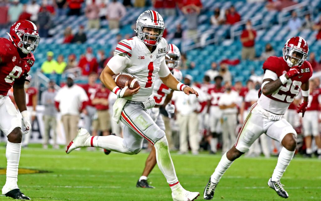 Justin Fields runs in National Championship Game. Credit: Kim Klement, USA TODAY Sports.