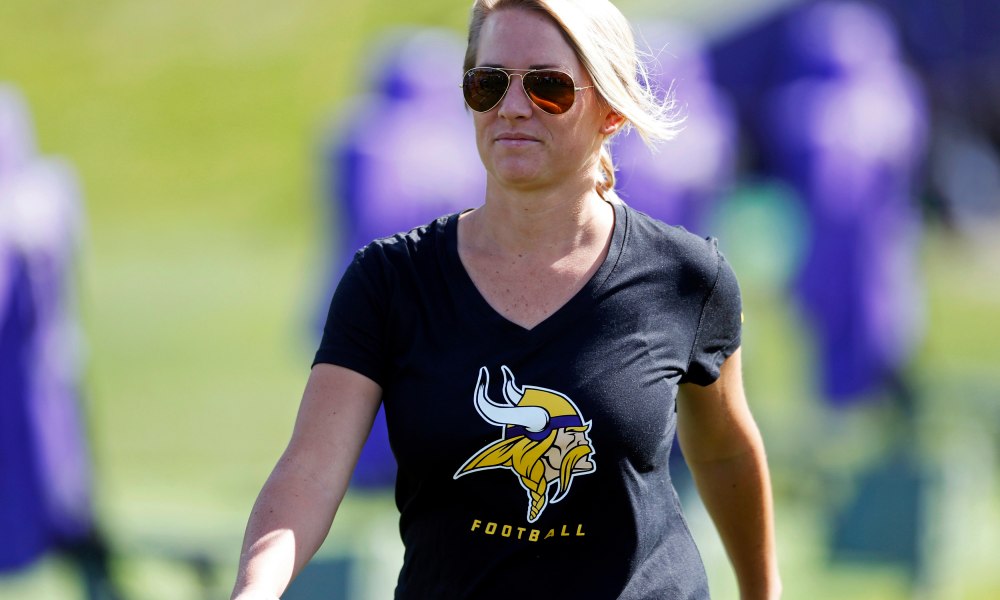 Kelly Kleine, the the Minnesota Vikings coordinator of college scouting, poses during NFL football practice in Eden Prairie, Minn. Kleine started with the Vikings as a public relations intern but has spent the last five years in the scouting department and has gradually added more responsibilities to her plate. Now she also works with special teams to evaluate players in addition to organizing the scouting department