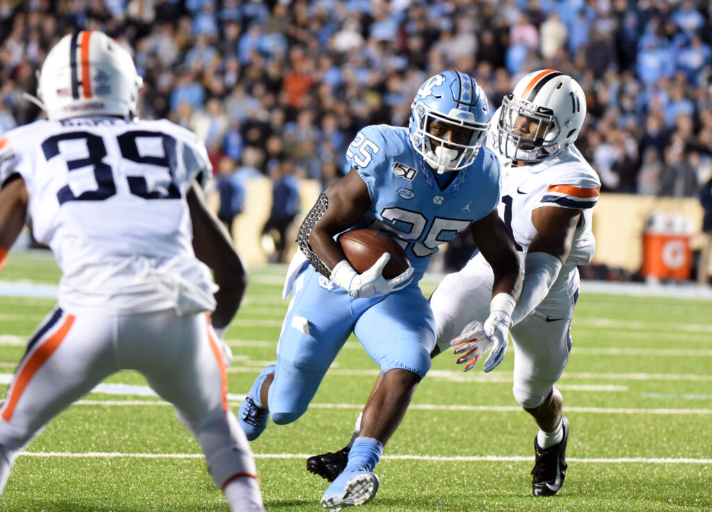 North Carolina Tar Heels running back Javonte Williams (25) runs the ball during the second half against the Virginia Cavaliers at Kenan Memorial Stadium. The Cavaliers won 38-31.