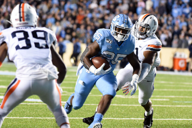 North Carolina Tar Heels running back Javonte Williams (25) runs the ball during the second half against the Virginia Cavaliers at Kenan Memorial Stadium. The Cavaliers won 38-31.