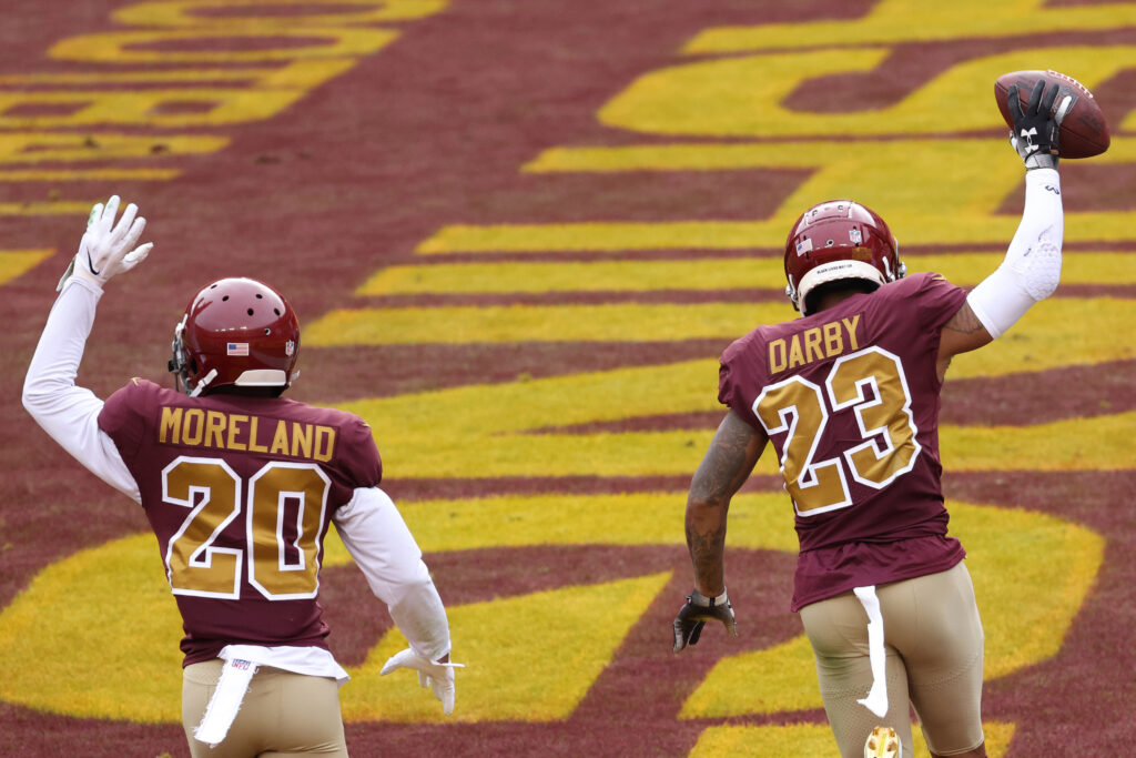 Washington Football Team cornerback Ronald Darby (23) celebrates with Washington Football Team cornerback Jimmy Moreland (20) after recovering a fumble in the end zone against the Cincinnati Bengals at FedExField.