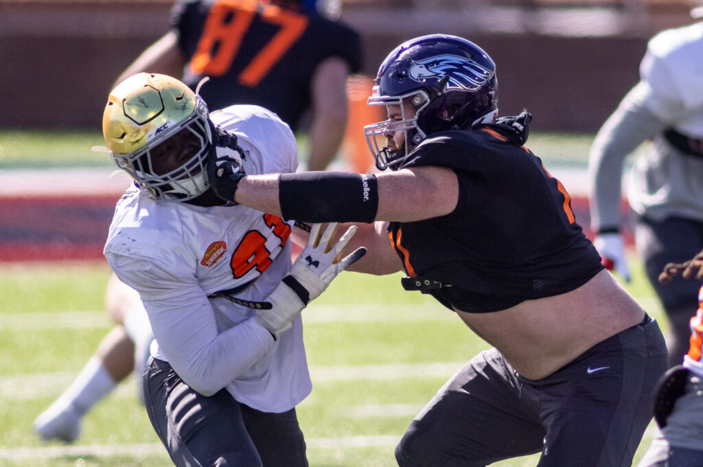 National defensive lineman Ade Ogundeji of Notre Dame (91) drills against National offensive lineman Quinn Meinerz of Wisconsin -Whitewater (71) during National practice at Hancock Whitney Stadium in Mobile, Alabama, USA