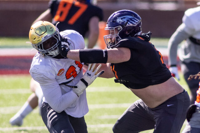 National defensive lineman Ade Ogundeji of Notre Dame (91) drills against National offensive lineman Quinn Meinerz of Wisconsin -Whitewater (71) during National practice at Hancock Whitney Stadium in Mobile, Alabama, USA