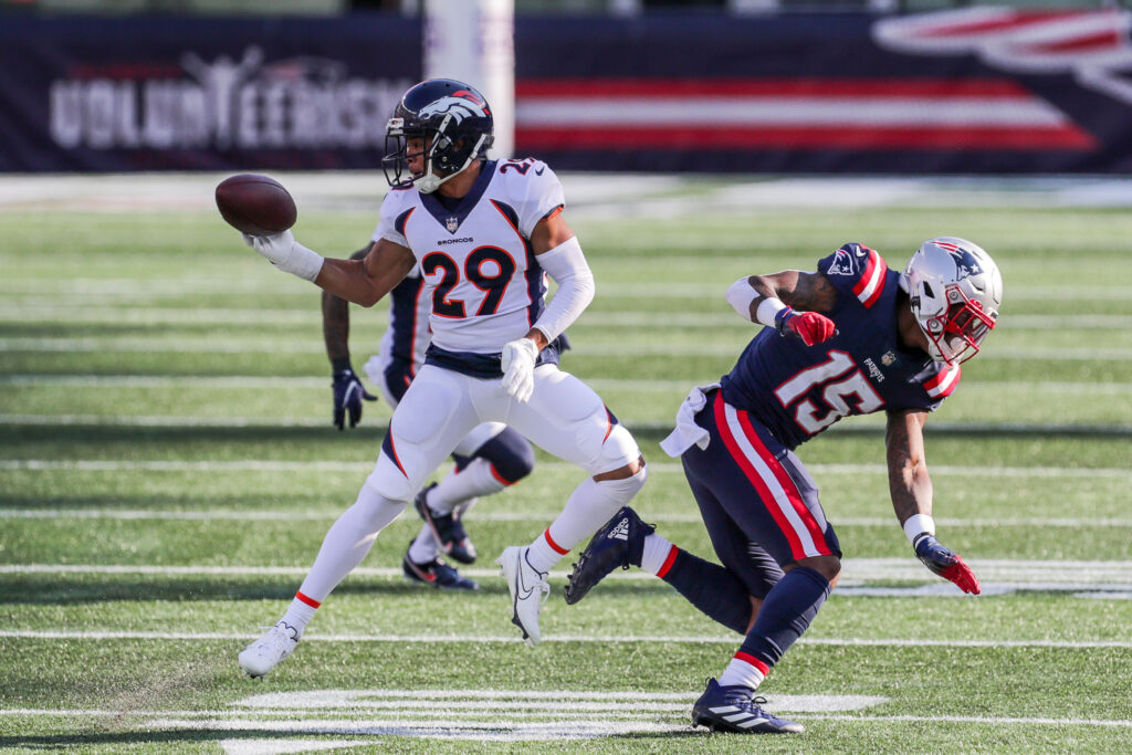 Denver Broncos cornerback Bryce Callahan (29) intercepts a pass against the New England Patriots during the second half at Gillette Stadium.