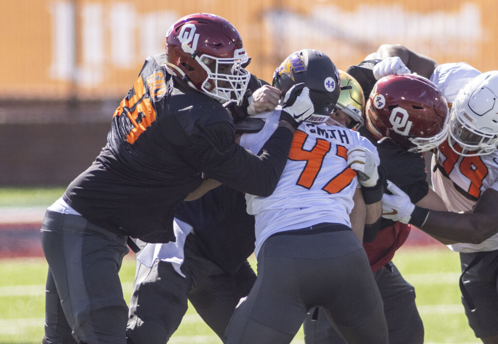 National offensive lineman Adrian Ealy of Oklahoma (79) drills against National defensive lineman Elerson Smith of Northern Iowa (47) during National practice at Hancock Whitney Stadium.