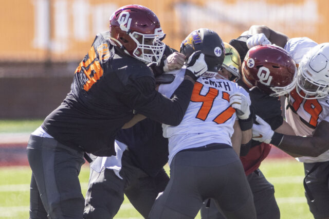 National offensive lineman Adrian Ealy of Oklahoma (79) drills against National defensive lineman Elerson Smith of Northern Iowa (47) during National practice at Hancock Whitney Stadium.