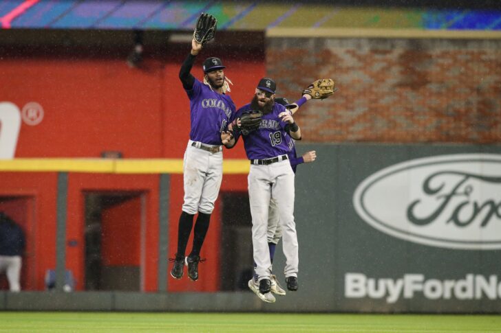 Colorado Rockies left fielder Raimel Tapia (15) and right fielder Charlie Blackmon (19) and center fielder Garrett Hampson (1) celebrate after defeating the Atlanta Braves at Truist Park.