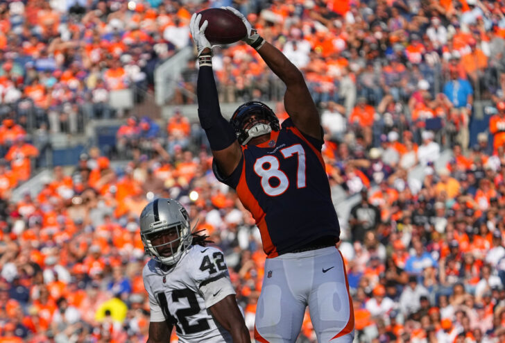 Denver Broncos tight end Noah Fant (87) pulls in a reception past Las Vegas Raiders inside linebacker Cory Littleton (42) in the first half at Empower Field at Mile High.