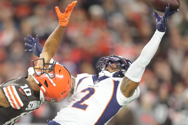 Cleveland Browns' Anthony Schwartz can't get to a deep ball as Denver Broncos' Par Surtain II defends on Thursday, Oct. 21, 2021 in Cleveland, Ohio, at FirstEnergy Stadium.