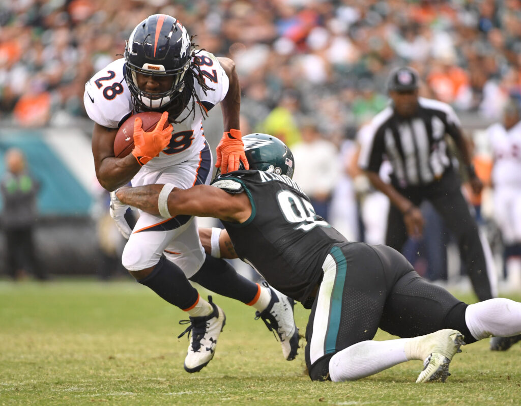 Denver Broncos running back Jamaal Charles (28) is tackled by Philadelphia Eagles outside linebacker Mychal Kendricks (95) during the fourth quarter at Lincoln Financial Field