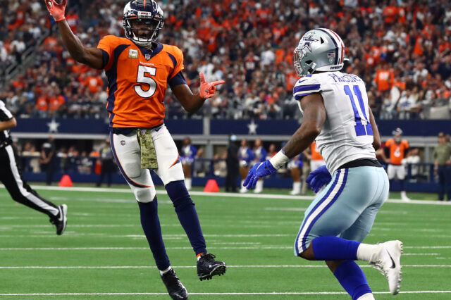 Denver Broncos quarterback Teddy Bridgewater (5) throws on the run for a two point conversion in the fourth quarter against Dallas Cowboys linebacker Micah Parsons (11) at AT&T Stadium.