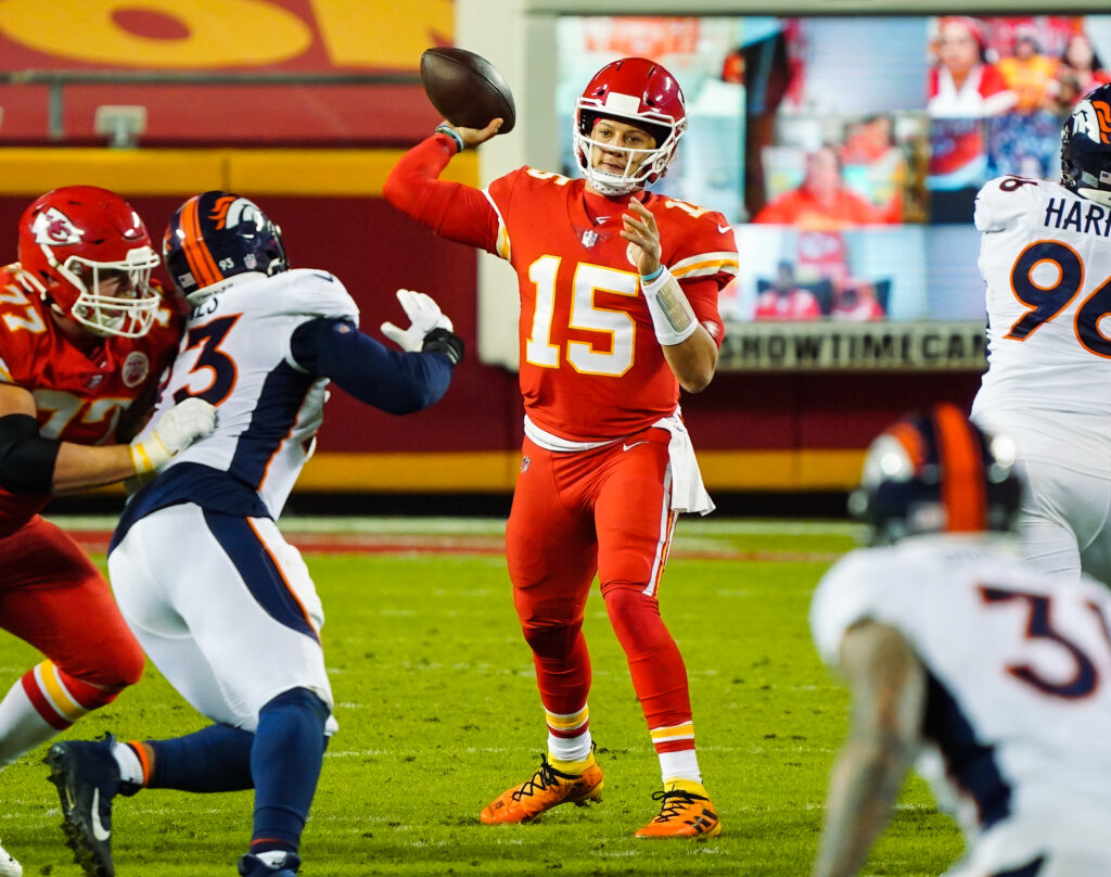 Kansas City Chiefs quarterback Patrick Mahomes (15) throws a pass against the Denver Broncos during the second half at Arrowhead Stadium.