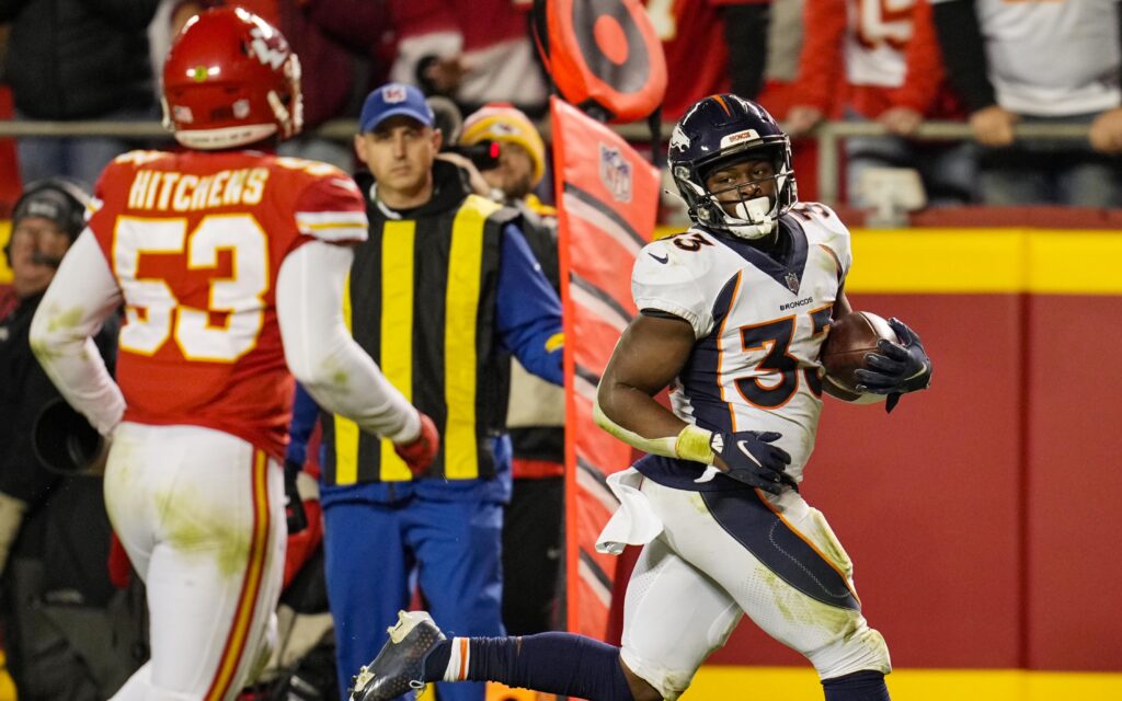 Javonte Williams looks at the defense as he takes a reception into the end zone on Sunday night. Credit: Jay Biggerstaff, USA TODAY Sports.