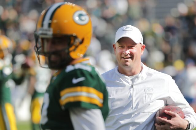 Aaron Rodgers and Nathaniel Hackett in 2019. Credit: Mark Hoffman,