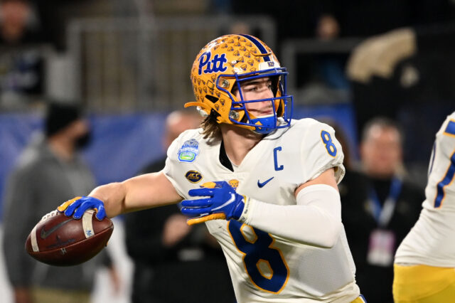 Pittsburgh Panthers quarterback Kenny Pickett (8) looks to pass in the first quarter of the ACC championship game at Bank of America Stadium.