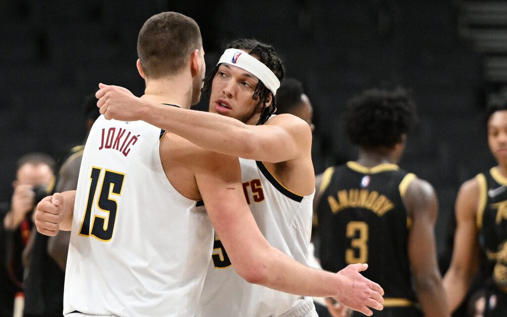 Nikola Jokic and Aaron Gordon hug after Jokic's huge block. Credit: Dan Hamilton, USA TODAY Sports.