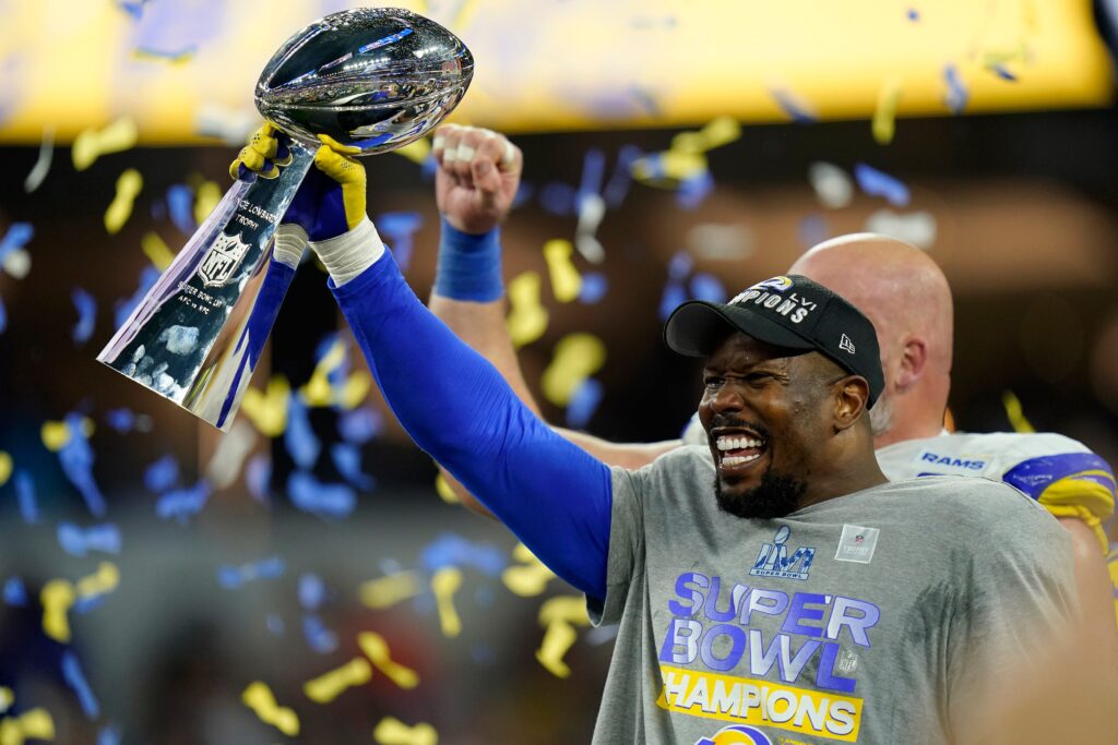 Los Angeles Rams outside linebacker Von Miller (40) raises the Vince Lombardi Trophy after Super Bowl 56 between the Cincinnati Bengals and the Los Angeles Rams at SoFi Stadium in Inglewood, Calif., on Sunday, Feb. 13, 2022. The Rams came back in the final minutes of the game to win 23-20 on their home field.