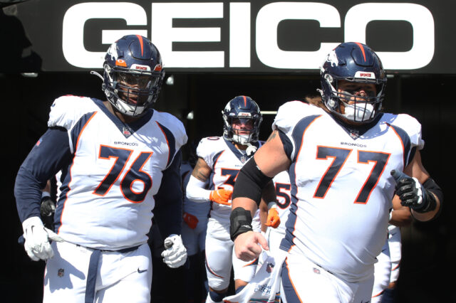 Denver Broncos offensive tackle Calvin Anderson (76) and guard Quinn Meinerz (77) take the field to play the Pittsburgh Steelers at Heinz Field. The Steelers won 27-19.