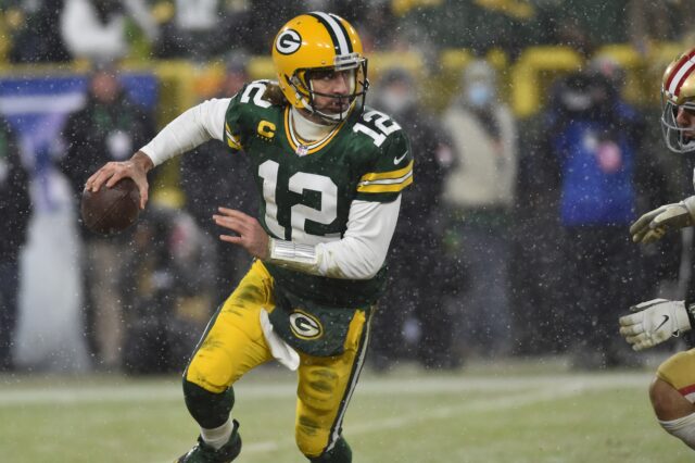 Rodgers rolls out. Credit: Jeffrey Baker, USA TODAY Sports.