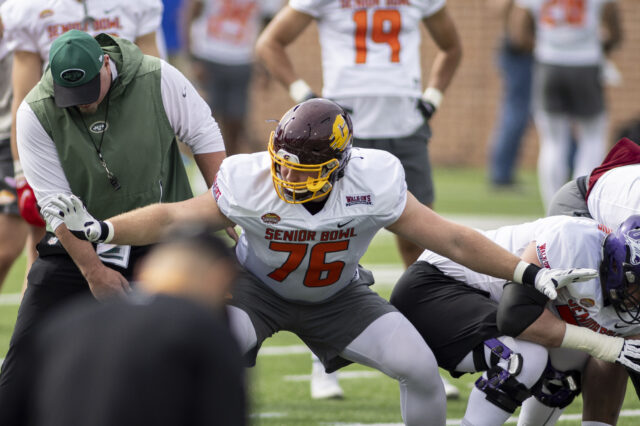 National offensive lineman Bernhard Raimann of Central Michigan (76) works with a coach during National practice for the 2022 Senior Bowl at Hancock Whitney Stadium. National offensive lineman Bernhard Raimann of Central Michigan (76) works with a coach during National practice for the 2022 Senior Bowl at Hancock Whitney Stadium.