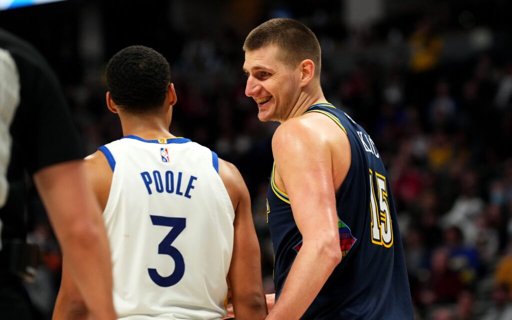 Nikola Jokic joking around. Credit: Ron Chenoy, USA TODAY Sports.