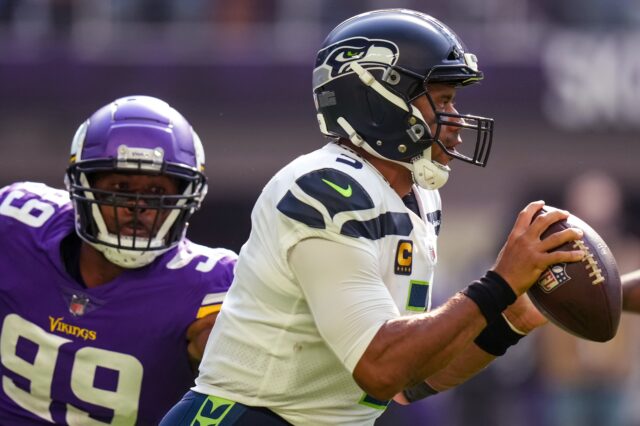 Russell Wilson pressured. Credit: Brace Hemmelgarn, USA TODAY Sports.