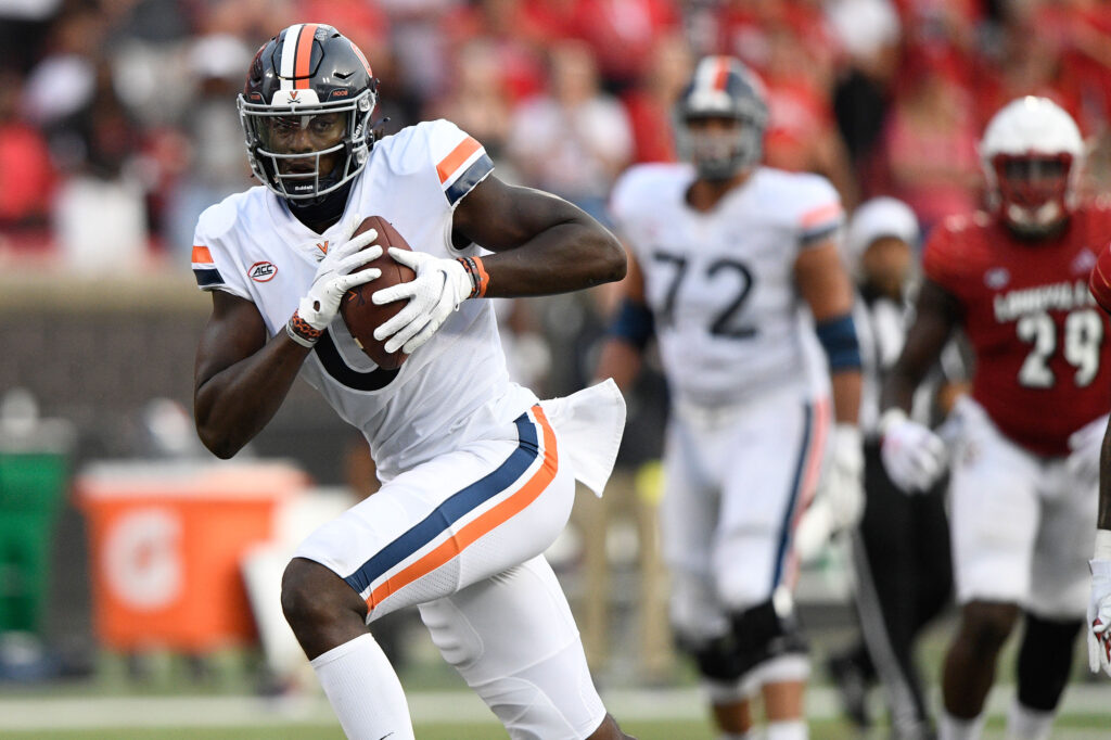 Virginia Cavaliers tight end Jelani Woods (0) runs the ball against the Louisville Cardinals during the second half at Cardinal Stadium. Virginia defeated Louisville 34-33.