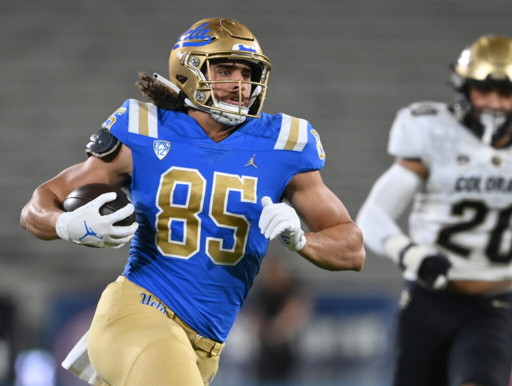 UCLA Bruins tight end Greg Dulcich (85) runs with the ball for a first down in the first half against the Colorado Buffaloes at Rose Bowl.