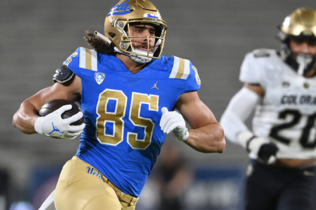 UCLA Bruins tight end Greg Dulcich (85) runs with the ball for a first down in the first half against the Colorado Buffaloes at Rose Bowl.