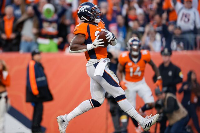 Melvin Gordon scores a touchdown against the Lions in December, 2021. Credit: Isaiah J. Downing, USA TODAY Sports.