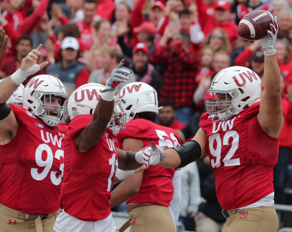 Wisconsin defensive end Matt Henningsen (92) celebrates his fumble recovery for a touchdown during the fourth quarter of their game against Northwestern at Camp Randall Stadium.