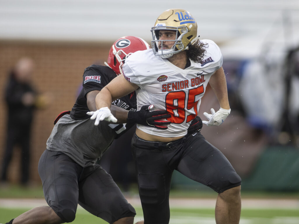 American tight end Greg Dulcich of UCLA (85) breaks through the grip of American linebacker Channing Tindall of Georgia (41) during American practice for the 2022 Senior Bowl in Mobile, AL, USA.