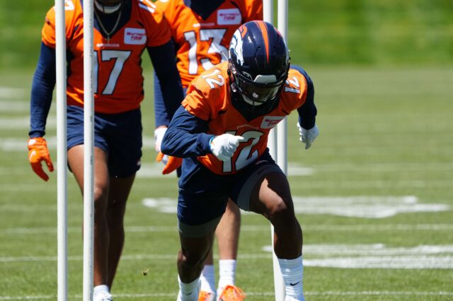 Montrell Washington (12) runs through drills at Broncos minicamp on Saturday, May 14. Credit: Ron Chenoy, USA TODAY Sports.