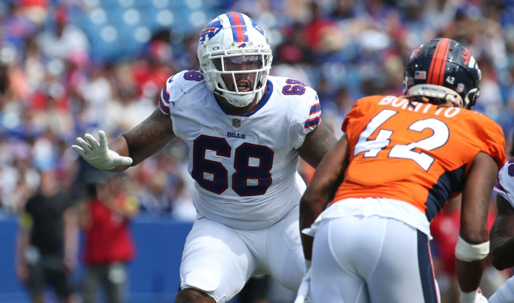 Bills right tackle Bobby Hart (68) blocks Denver Broncos linebacker Nik Bonitto (42) at the line during the Bills preseason game against Denver Saturday, Aug. 20, 2022 at Highmark Stadium.