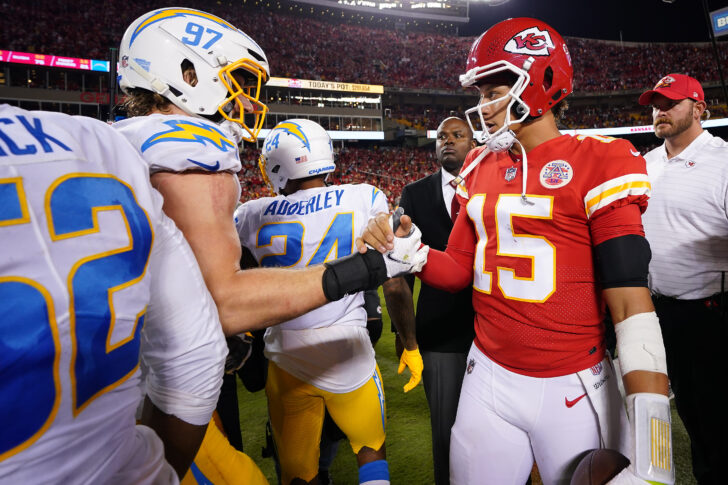 Kansas City Chiefs quarterback Patrick Mahomes (15) meets with Los Angeles Chargers linebacker Joey Bosa (97) following the game at GEHA Field at Arrowhead Stadium. (Denver Broncos)