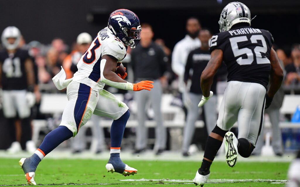 Javonte Williams runs against the Raiders on Oct. 2, 2022. Credit: Gary A. Vasquez, USA TODAY Sports.