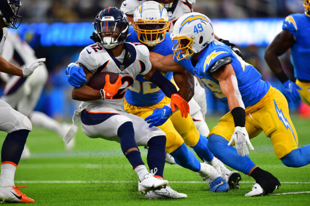 Denver Broncos wide receiver Montrell Washington (12) is brought down by Los Angeles Chargers linebacker Drue Tranquill (49) and linebacker Khalil Mack (52) during the first half at SoFi Stadium. (Coach Rosburg)