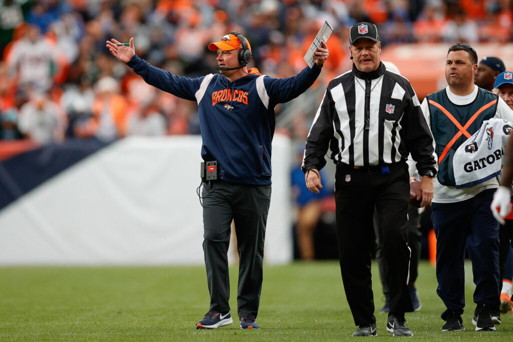 Denver Broncos head coach Nathaniel Hackett reacts after a play as down judge Jerry Bergman (91) looks on in the fourth quarter against the New York Jets at Empower Field at Mile High.