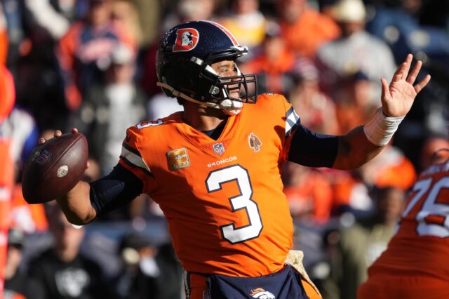 Russell Wilson throws against the Raiders. Credit: Ron Chenoy, USA TODAY Sports.