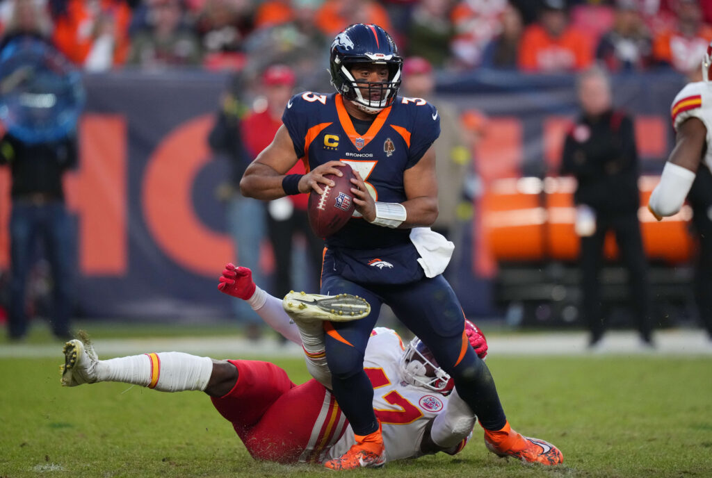 Kansas City Chiefs linebacker Darius Harris (47) sacks Denver Broncos quarterback Russell Wilson (3) in the third quarter at Empower Field at Mile High.