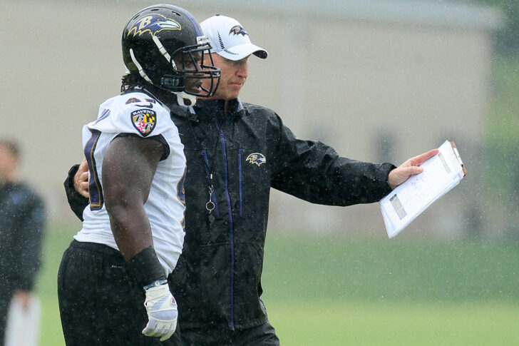 Special Teams coach Jerry Rosburg (now of the Denver Broncos) talks to linebacker Courtney Upshaw (left) during mini camp at the team facility in Owings Mills.