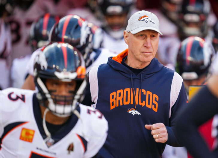 Denver Broncos interim head coach Jerry Rosburg and quarterback Russell Wilson (3) take the field prior to a game against the Kansas City Chiefs at GEHA Field at Arrowhead Stadium.