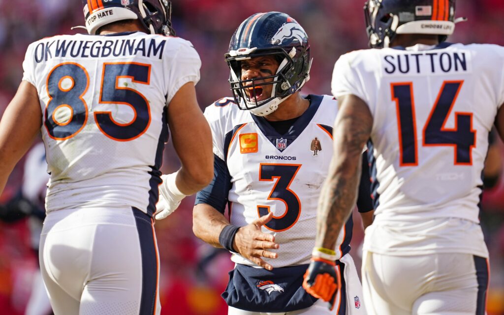 Russell Wilson celebrates with Albert Okwuegbunam and Courtland Sutton. Credit: Jay Biggerstaff, USA TODAY Sports.